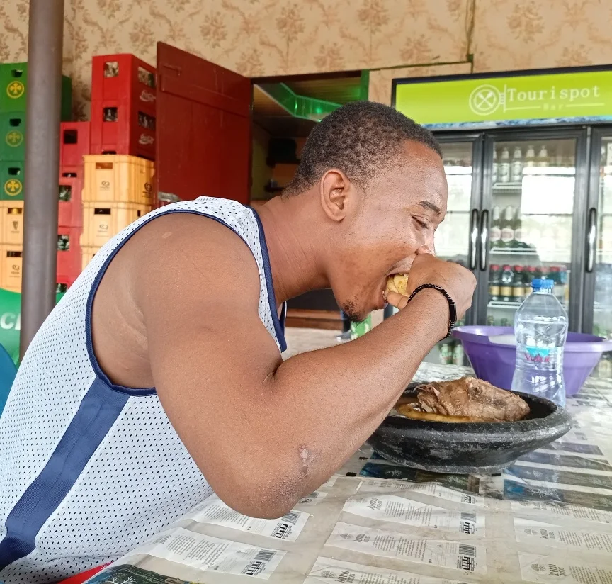 Guest eating at Tourispot Chop Bar